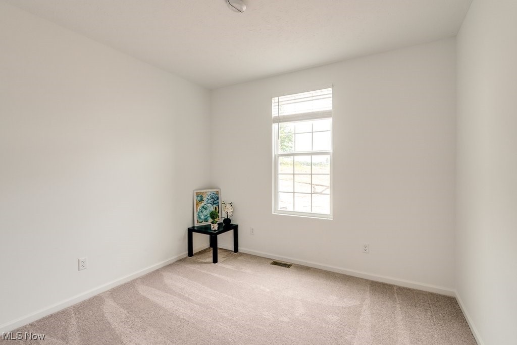 765 River Run Road Aurora, OH 44202 - Photo 18 of 35 first floor bedroom featuring light carpet