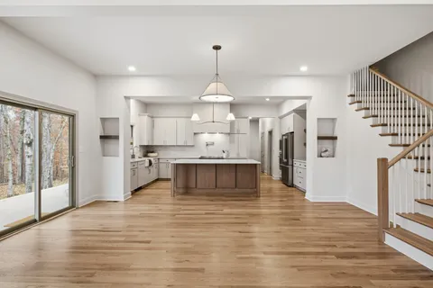 a kitchen with a sink cabinets and window