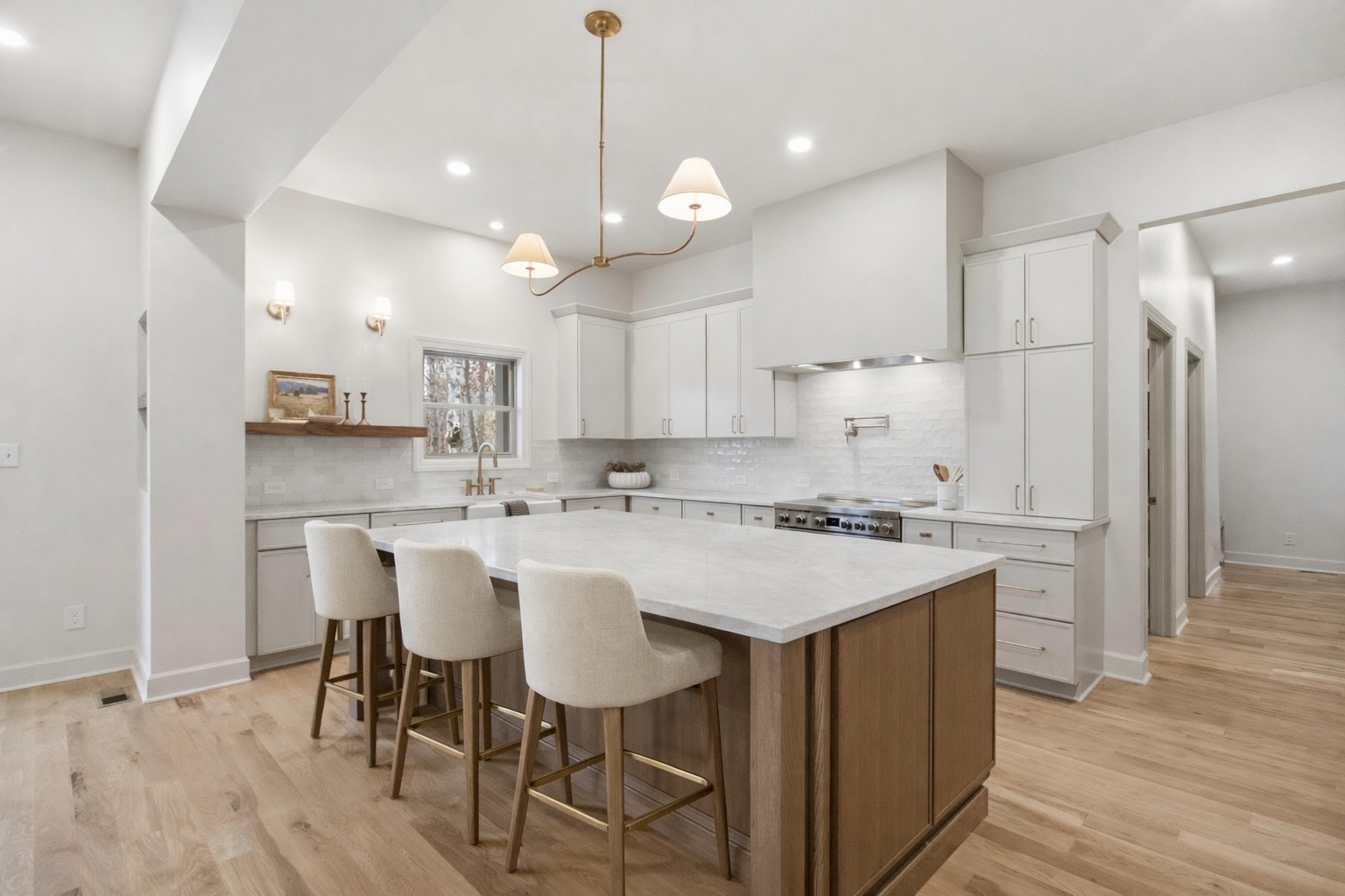 2957 Pace Road Clarksville, TN 37043 - Photo 4 of 67 a kitchen with a dining table chairs wooden floor cabinets and appliances