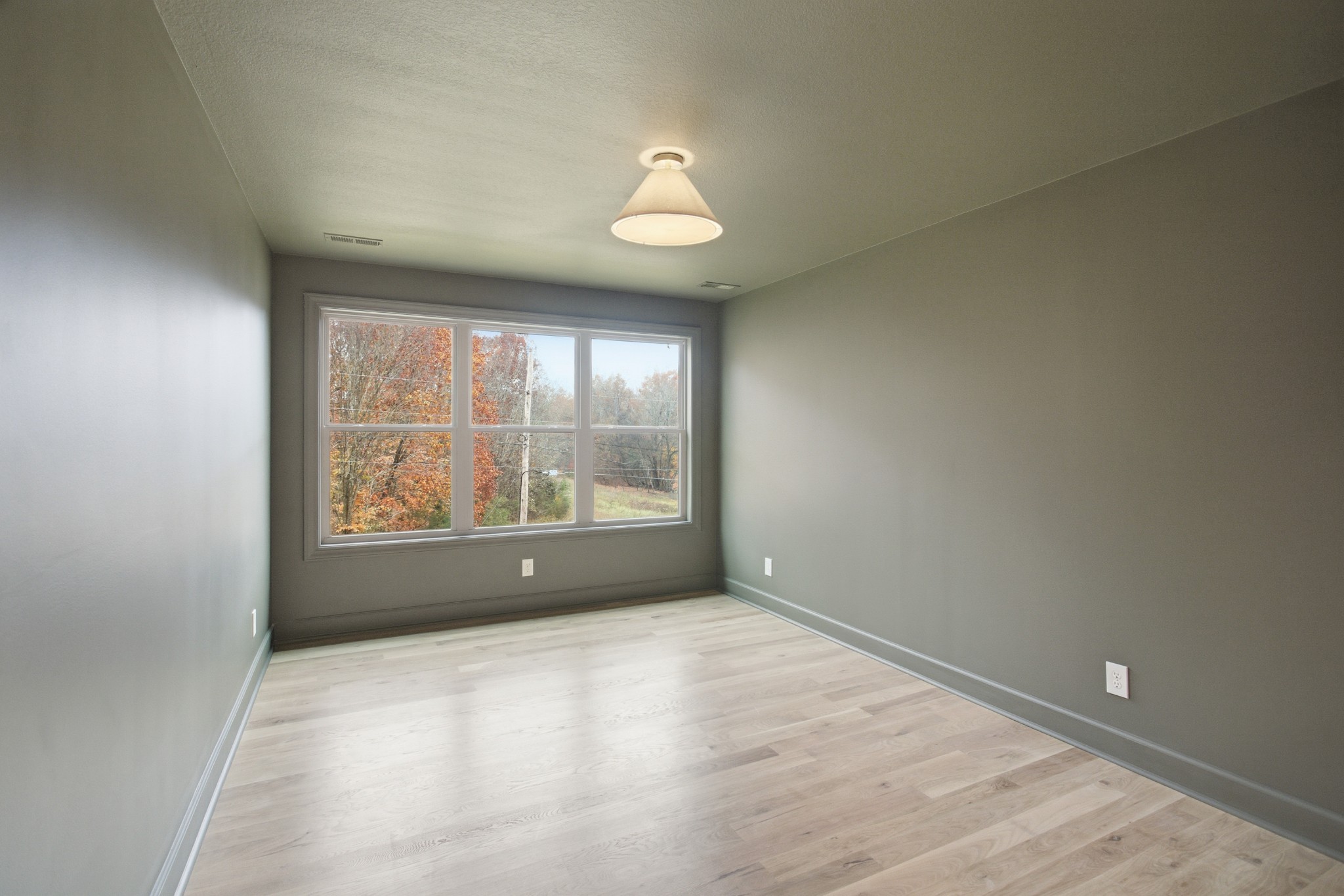 2957 Pace Road Clarksville, TN 37043 - Photo 44 of 82 an empty room with wooden floor and windows