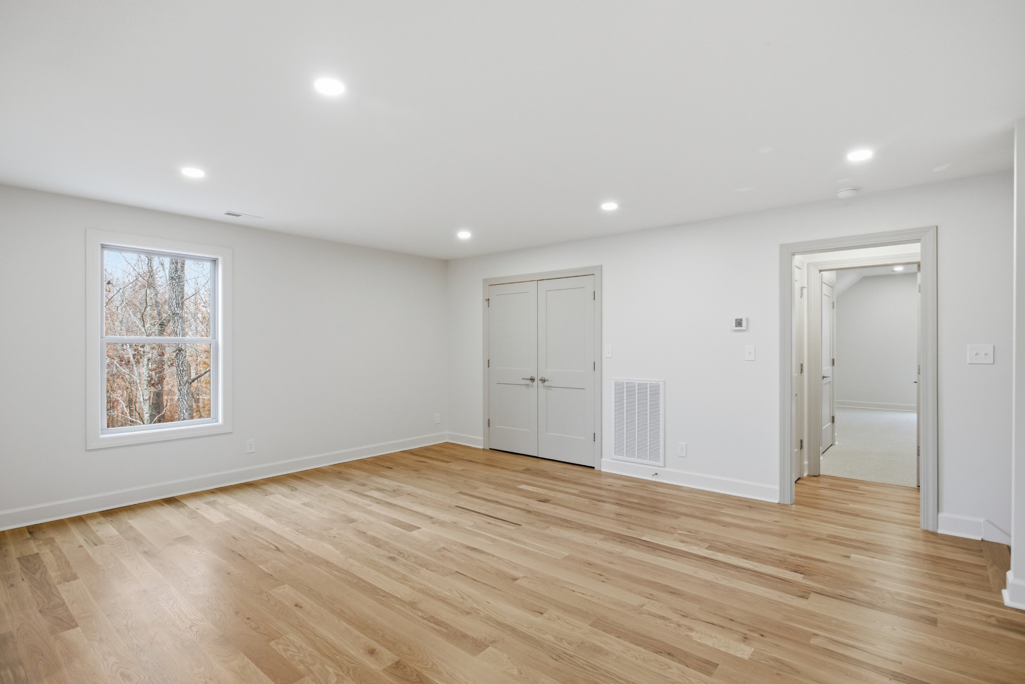 2957 Pace Road Clarksville, TN 37043 - Photo 46 of 67 an empty room with wooden floor and windows
