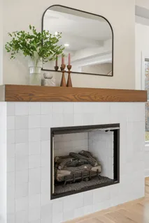 a spacious bathroom with a granite countertop sink a toilet and a mirror