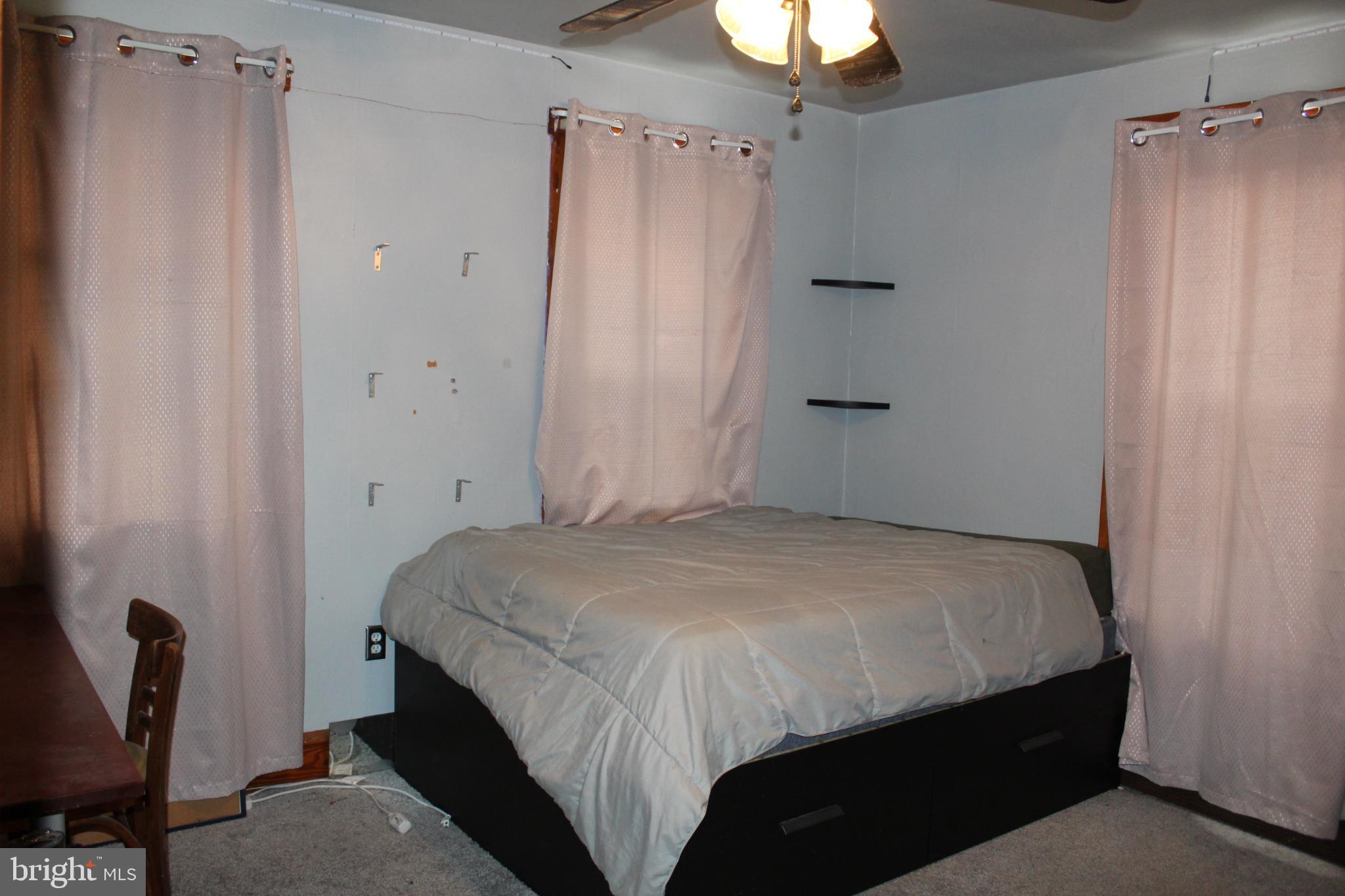 1616 Ward Street Linwood, PA 19061 - Photo 11 of 13 a bedroom with a bed and a window