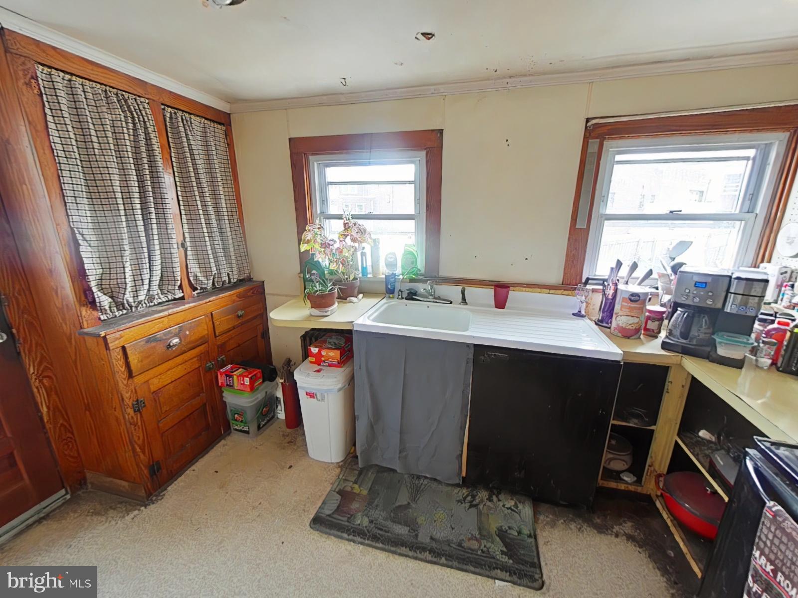1616 Ward Street Linwood, PA 19061 - Photo 7 of 13 a room with a storage stove a sink and a window