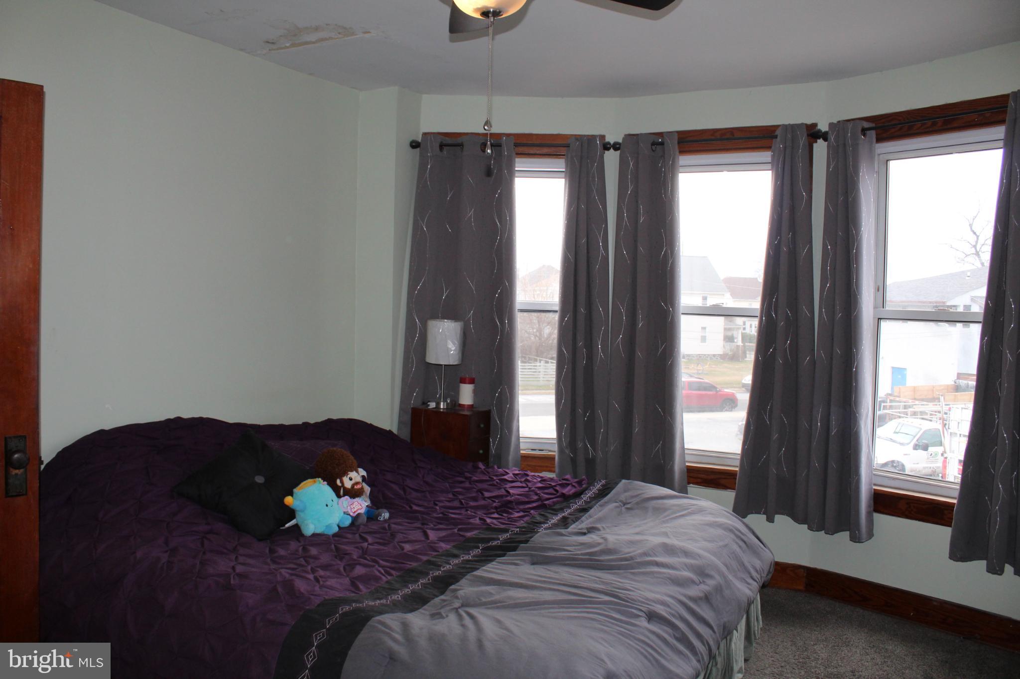 1616 Ward Street Linwood, PA 19061 - Photo 9 of 13 a bedroom with a bed and window