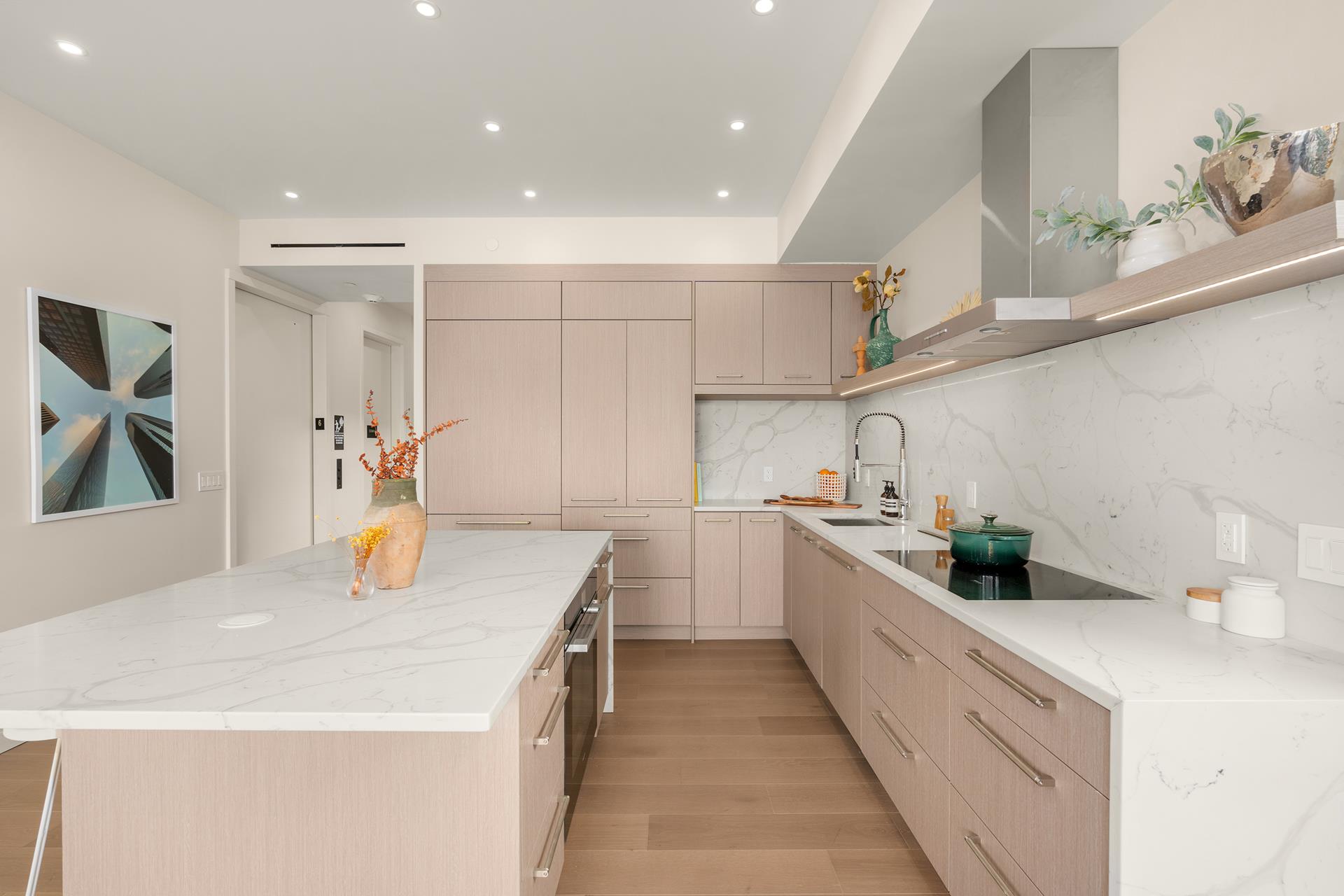 a kitchen with a sink a stove and cabinets
