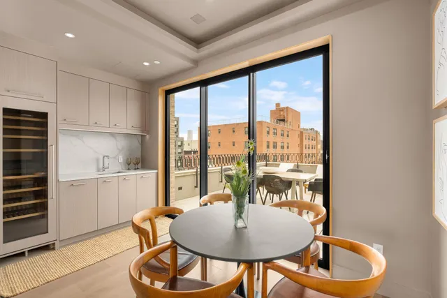 a kitchen with a table and chairs