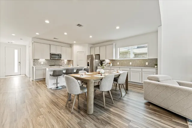 a bedroom with a bed and a chair