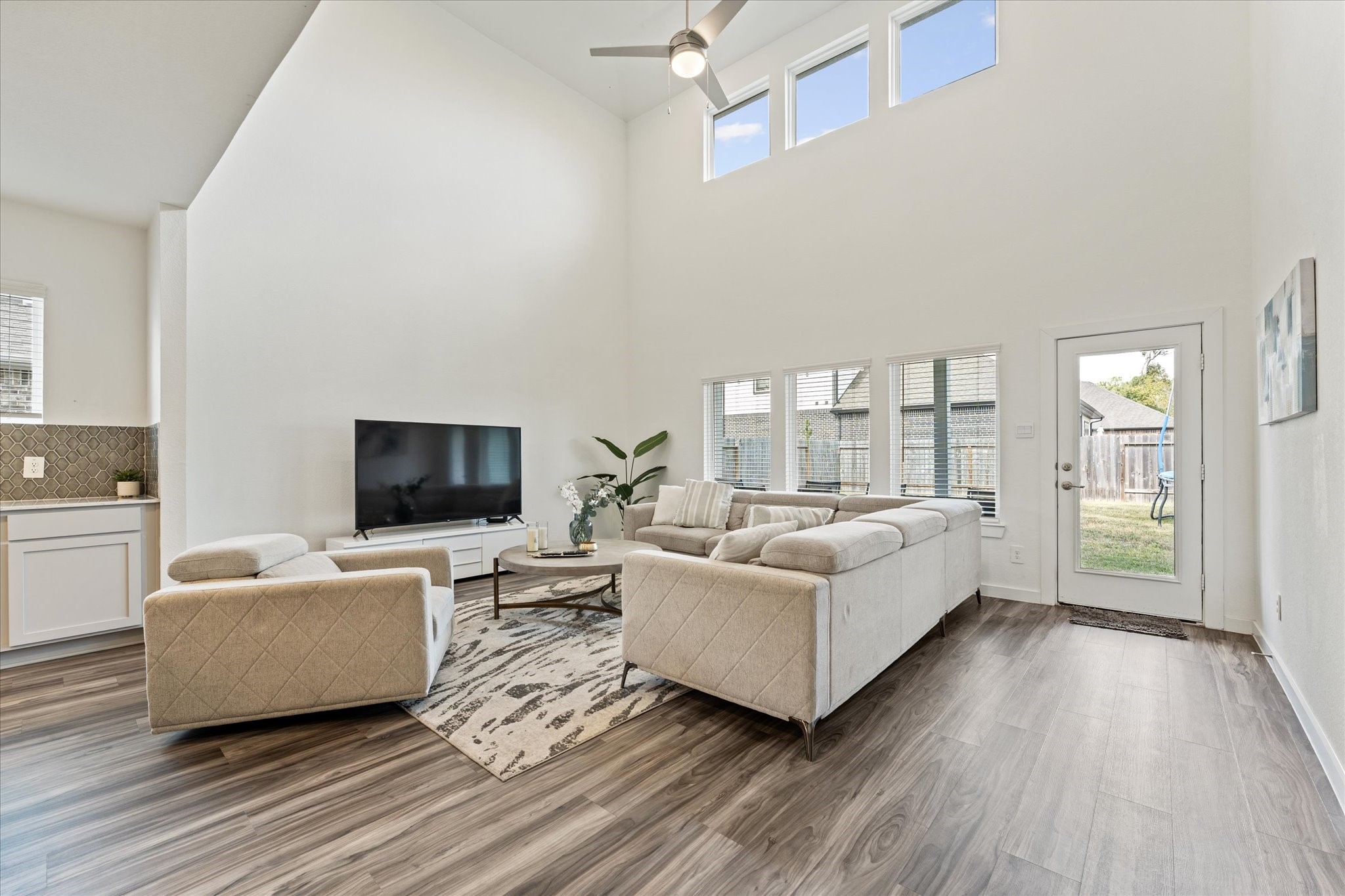 10212 Prairie Creek Lane Conroe, TX 77384 - Photo 18 of 41 a living room with furniture and a flat screen tv