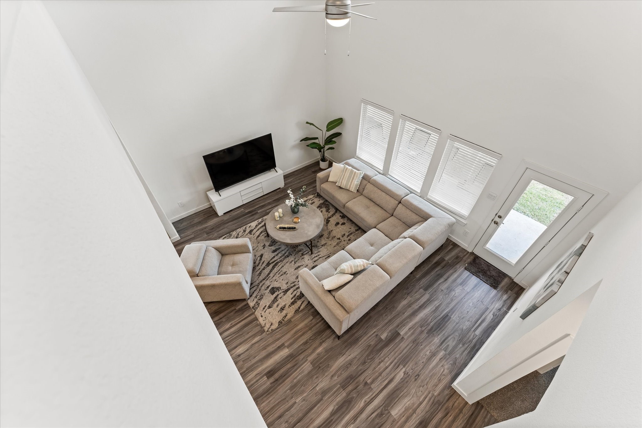 10212 Prairie Creek Lane Conroe, TX 77384 - Photo 21 of 41 a living room with furniture and a flat screen tv