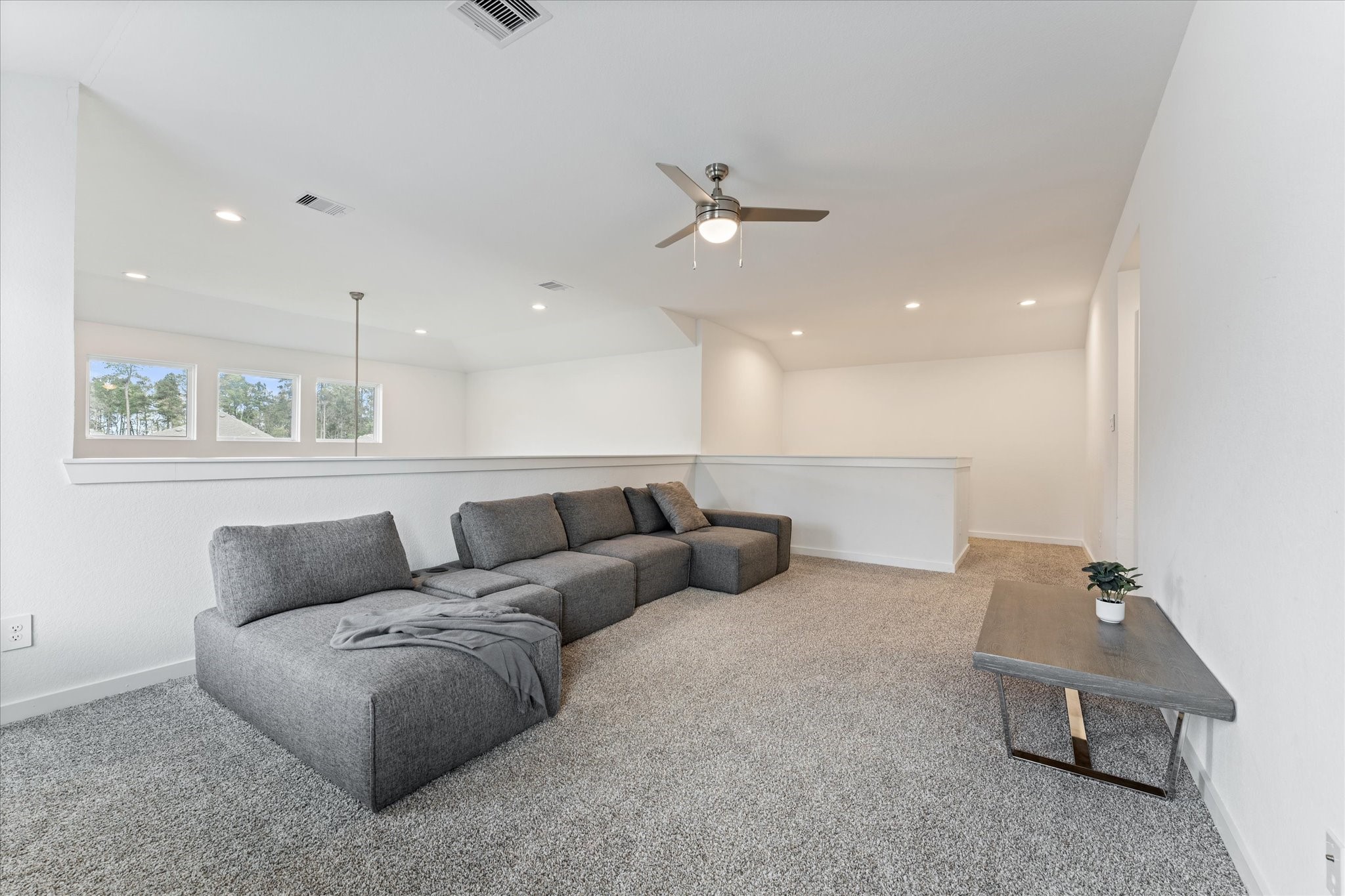 10212 Prairie Creek Lane Conroe, TX 77384 - Photo 24 of 41 a living room with furniture and a ceiling fan