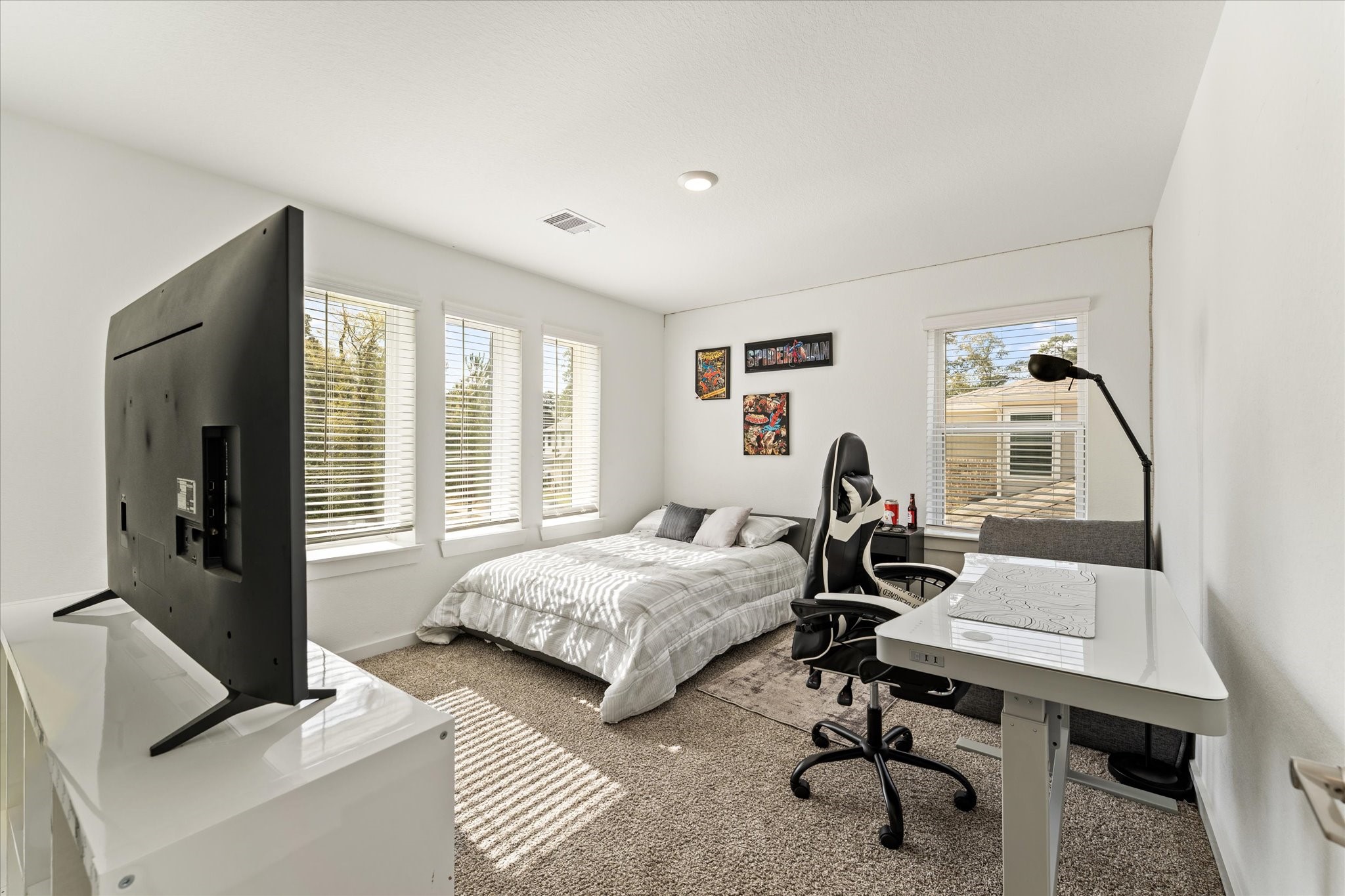 10212 Prairie Creek Lane Conroe, TX 77384 - Photo 25 of 41 a bedroom with bed and a window