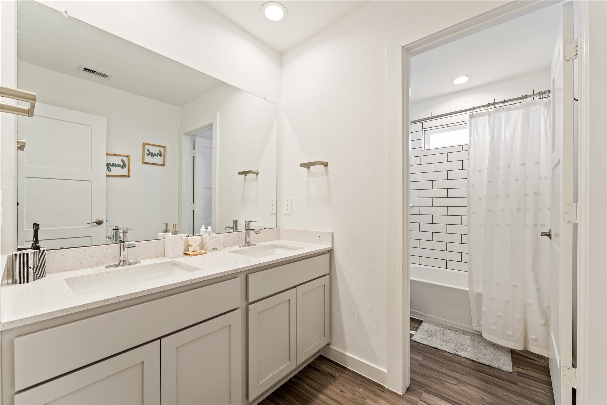 10212 Prairie Creek Lane Conroe, TX 77384 - Photo 30 of 41 a bathroom with 2 sink and a mirror