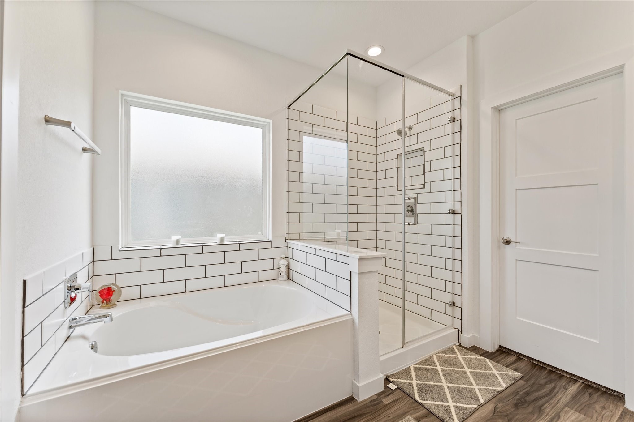 10212 Prairie Creek Lane Conroe, TX 77384 - Photo 34 of 41 a bathroom with a bathtub and a shower