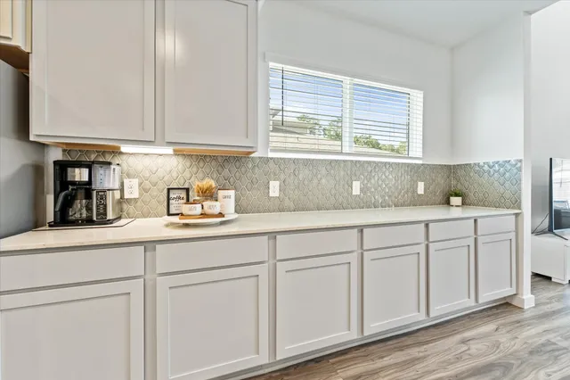 a kitchen with a sink and stove
