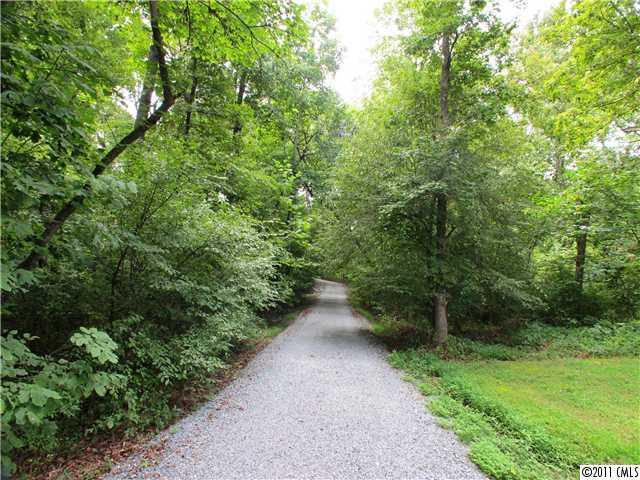 9601 Belt Road Midland, NC 28107 - Photo 2 of 16 a view of a yard with plants and trees