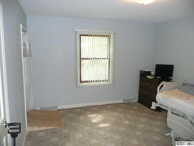 9601 Belt Road Midland, NC 28107 - Photo 14 of 16 a room with a bed and a window