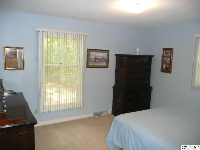 9601 Belt Road Midland, NC 28107 - Photo 15 of 16 a bedroom with a bed and a window
