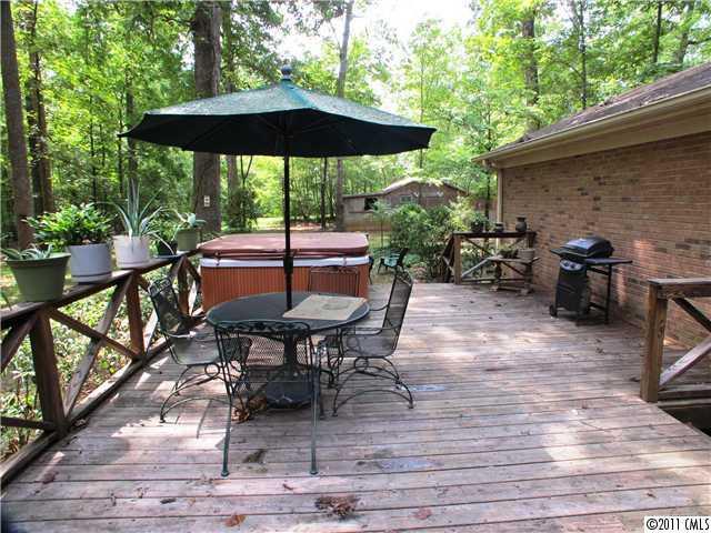 9601 Belt Road Midland, NC 28107 - Photo 16 of 16 a patio with wooden floor table and chairs