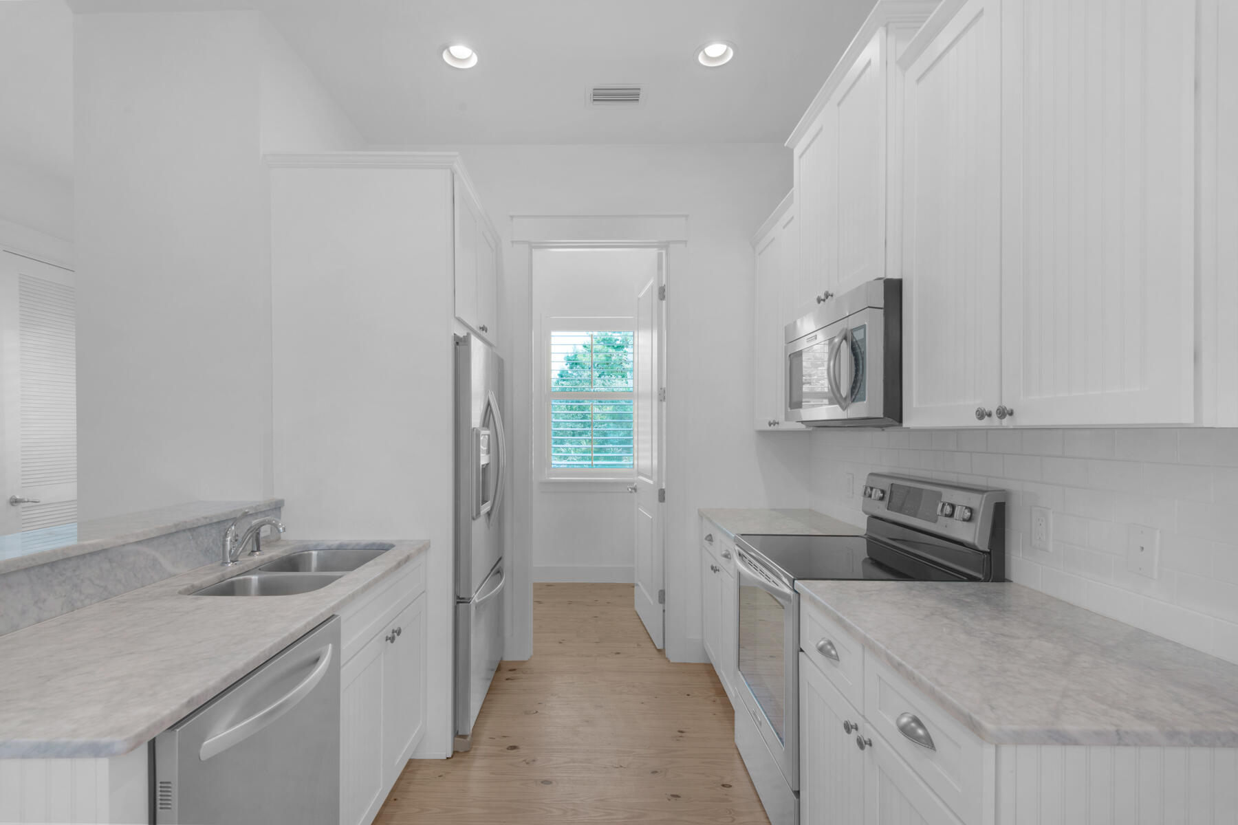 10 Gulfview Way Santa Rosa Beach, FL 32459 - Photo 8 of 30 a kitchen with sink cabinets and stove