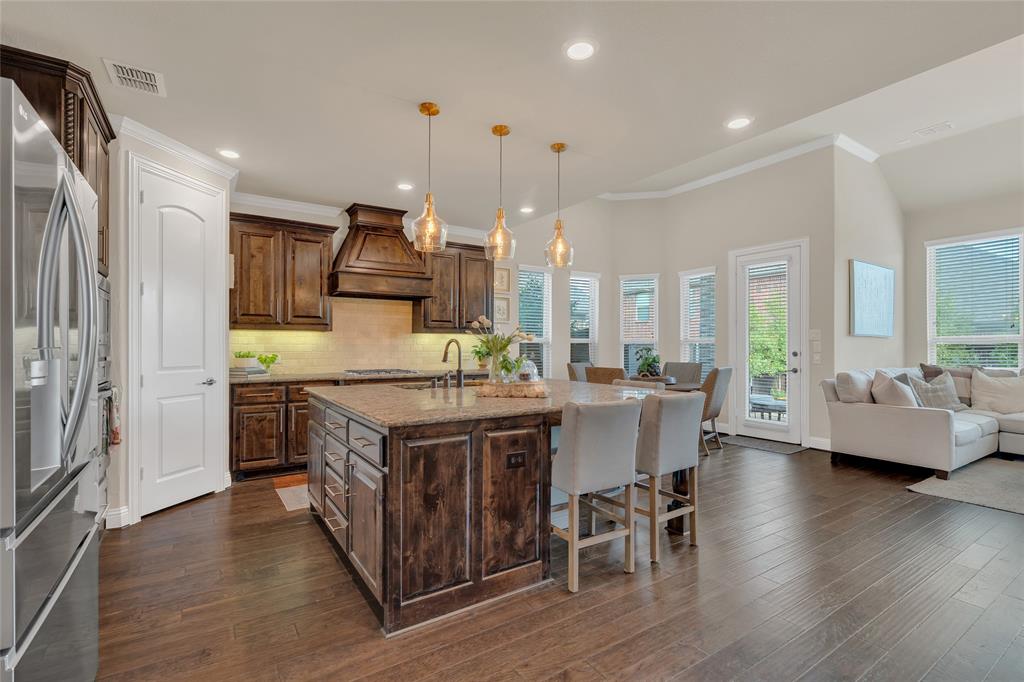 2852 Exeter Drive Trophy Club, TX 76262 - Photo 39 of 40 a kitchen that has a lot of cabinets in it and wooden floor
