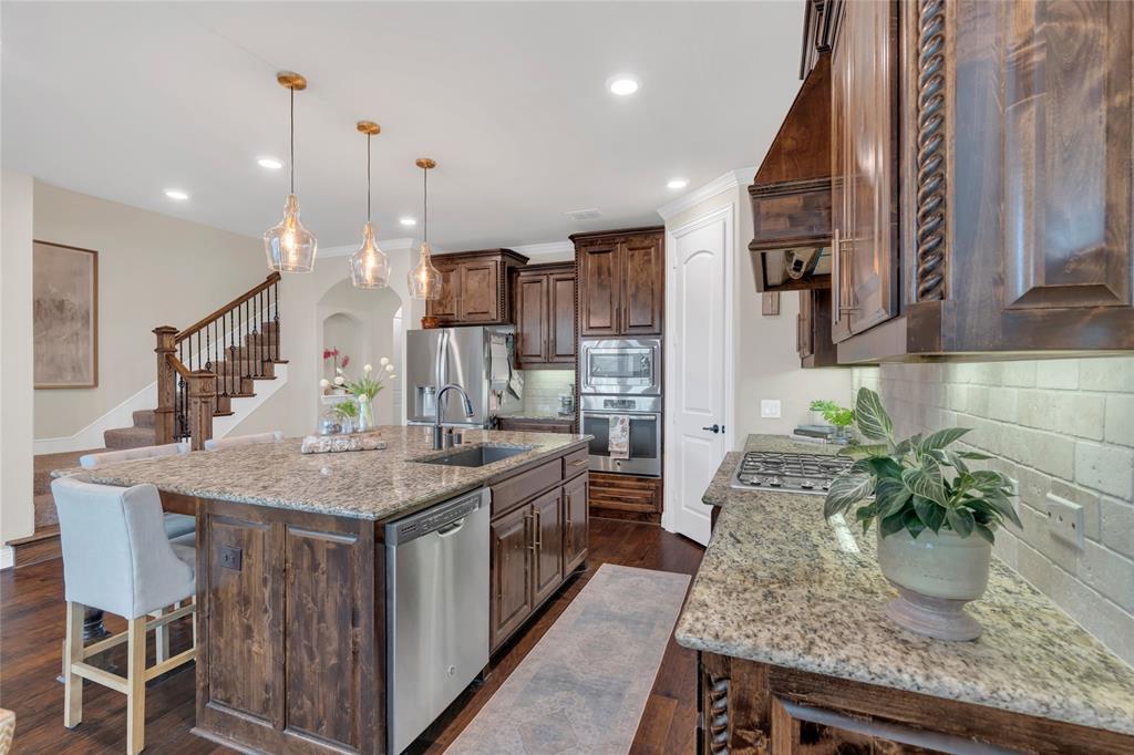 2852 Exeter Drive Trophy Club, TX 76262 - Photo 16 of 40 a kitchen with a table and chairs in it
