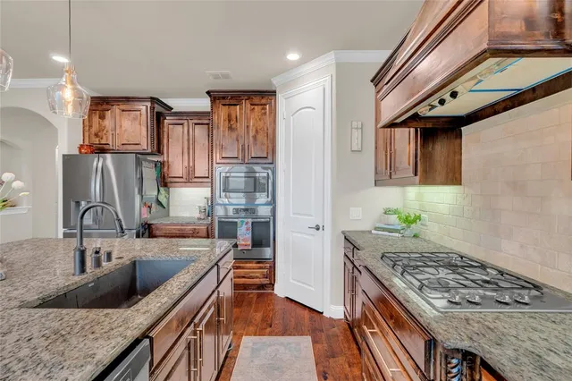 a kitchen with a table and chairs in it