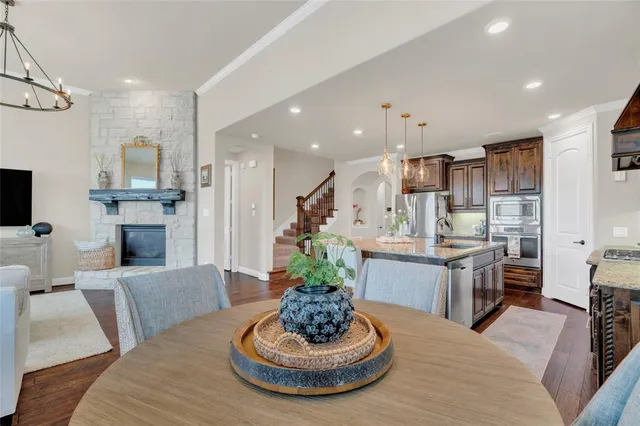 a kitchen with sink stove and cabinets