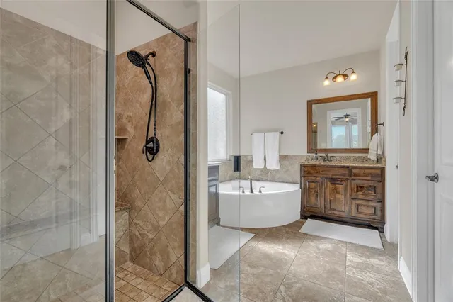 a bedroom with a large bed and wooden floor