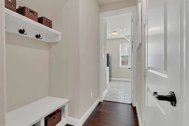 a bathroom with a granite countertop bathtub a sink and a mirror