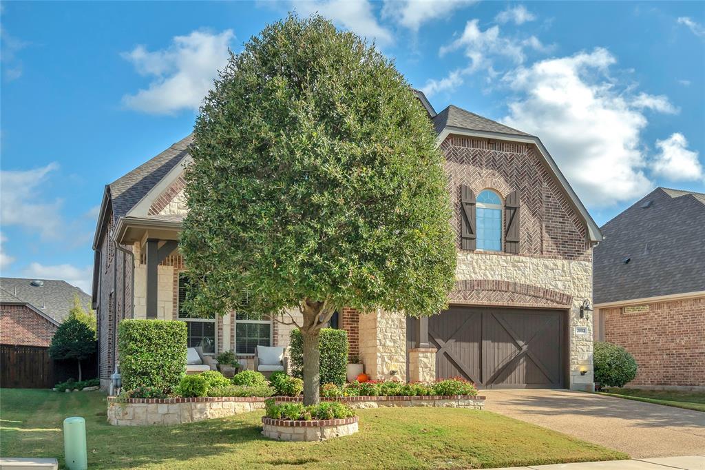 2852 Exeter Drive Trophy Club, TX 76262 - Photo 3 of 40 a front view of a house with garden