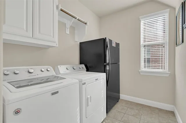 a bathroom with a tub a sink and a mirror