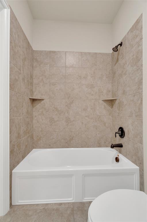 2852 Exeter Drive Trophy Club, TX 76262 - Photo 32 of 40 a bathroom with a bathtub and a toilet