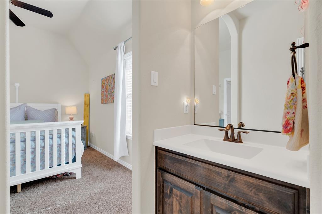 2852 Exeter Drive Trophy Club, TX 76262 - Photo 33 of 40 a bathroom with a sink and a mirror