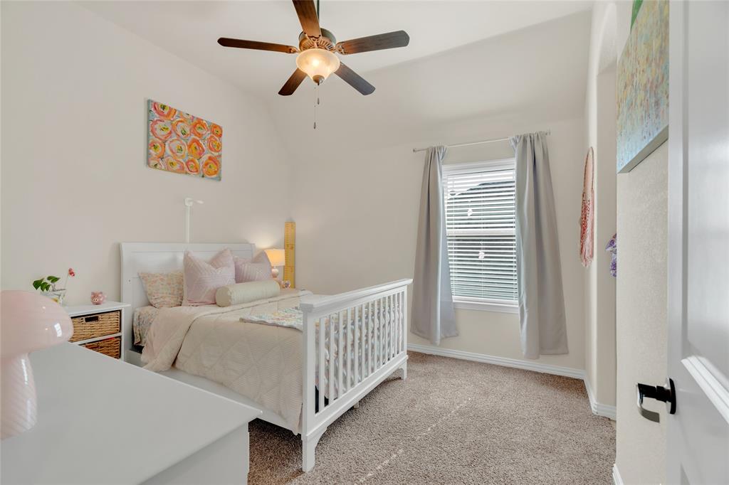 2852 Exeter Drive Trophy Club, TX 76262 - Photo 34 of 40 a bedroom with furniture and a window