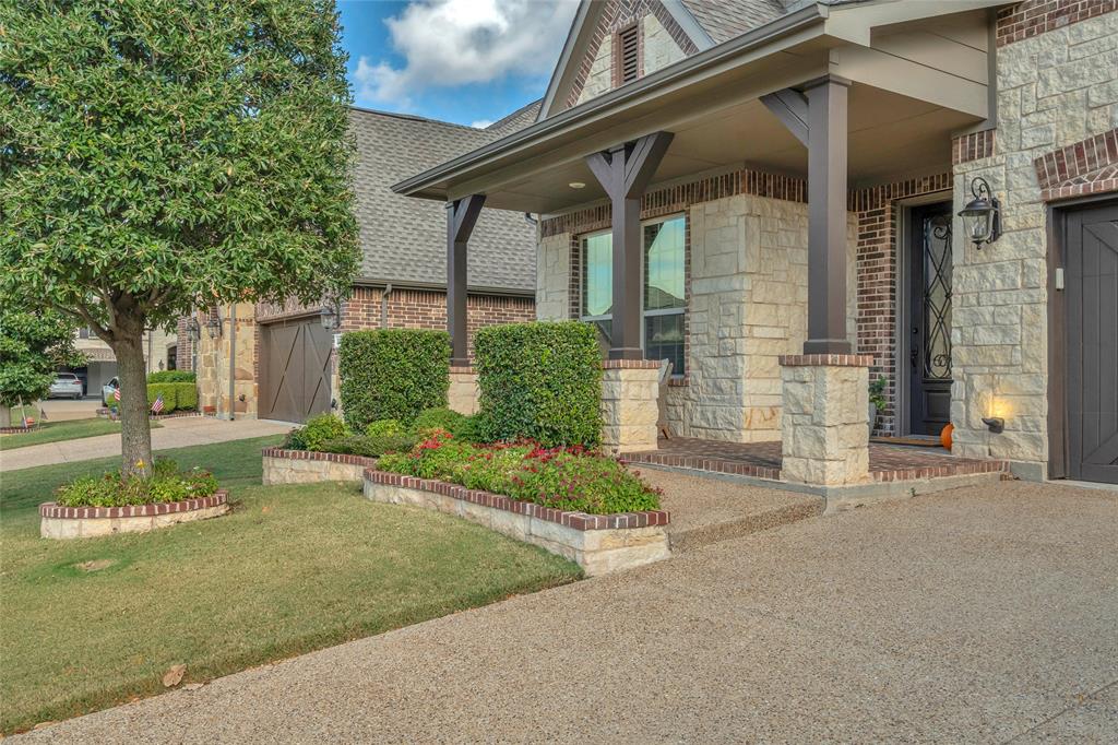 2852 Exeter Drive Trophy Club, TX 76262 - Photo 4 of 40 a front view of a house with garden