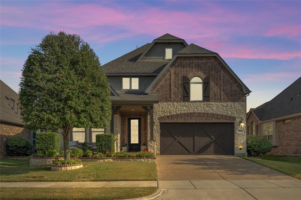 2852 Exeter Drive Trophy Club, TX 76262 - Photo 5 of 40 a front view of a house with a yard