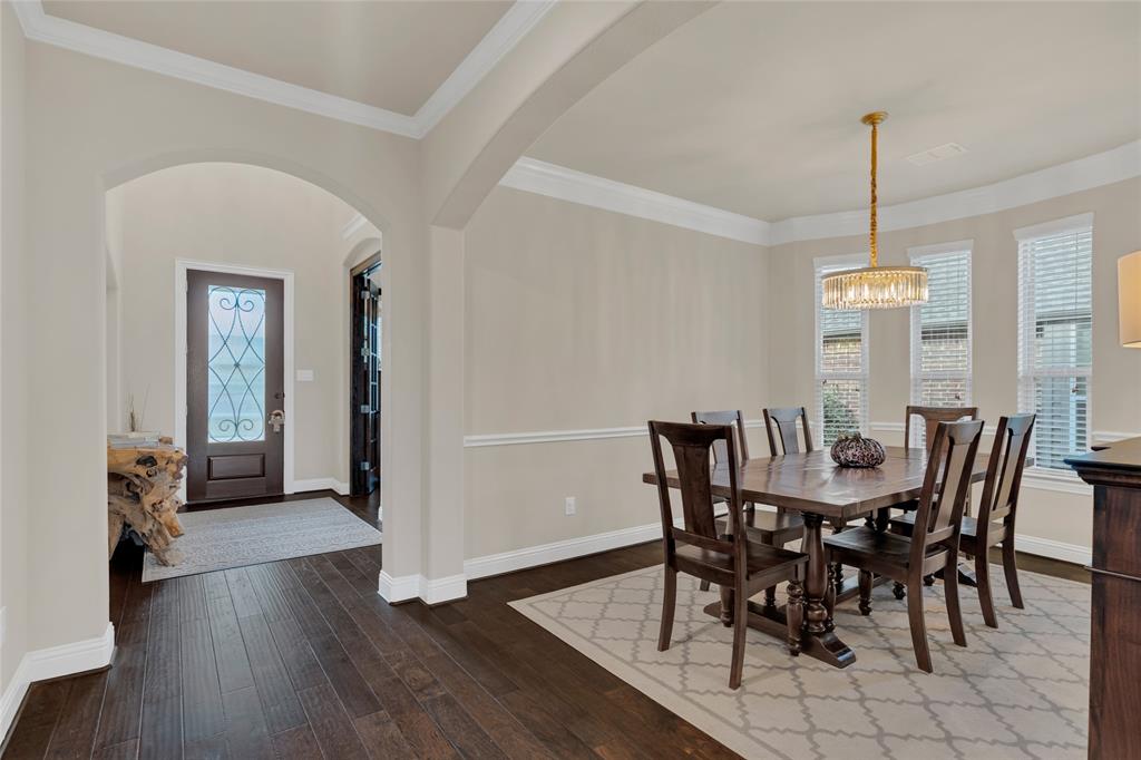 2852 Exeter Drive Trophy Club, TX 76262 - Photo 10 of 40 a view of a dining room with furniture window and wooden floor
