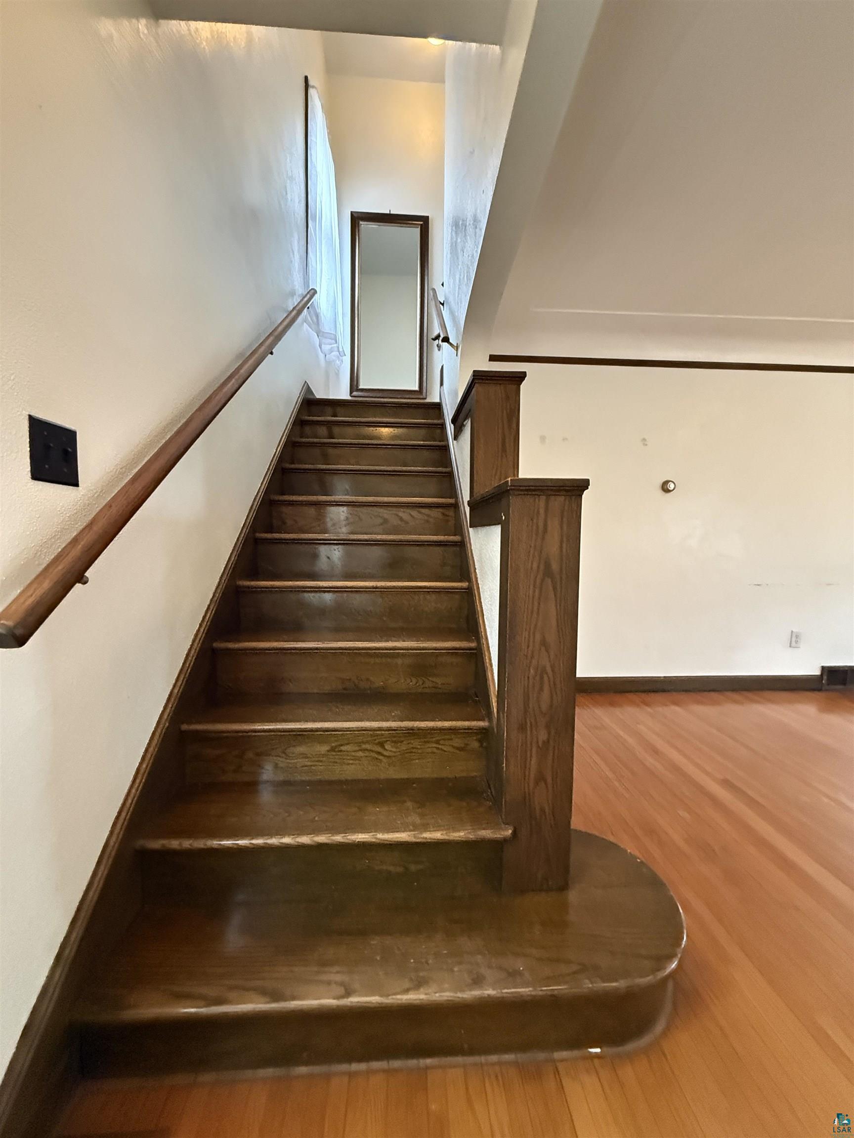 3001 3rd Avenue West Hibbing, MN 55746 - Photo 19 of 38 Staircase with wood finished floors
