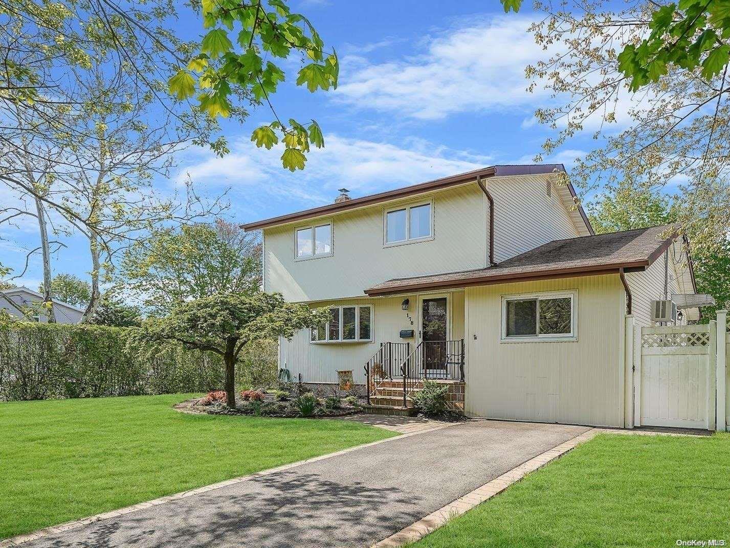 178 Colonial Springs Road Wheatley Heights, NY 11798 - Photo 1 of 1 a view of a house with a yard