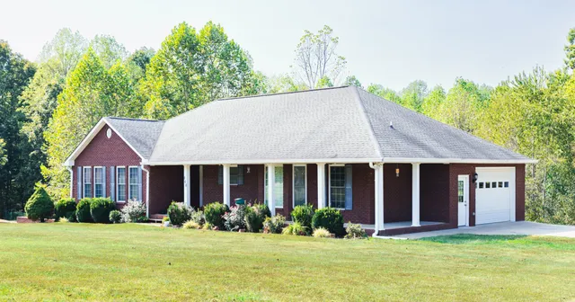 a front view of a house with a balcony and door