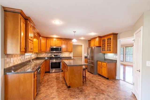 a kitchen with lots of counter top space and appliances
