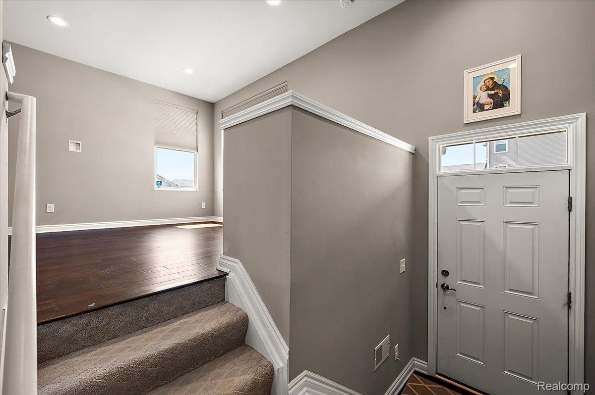 2877 Hartwick Drive Rochester, MI 48307 - Photo 11 of 44 Entrance foyer with dark wood-style floors and recessed lighting