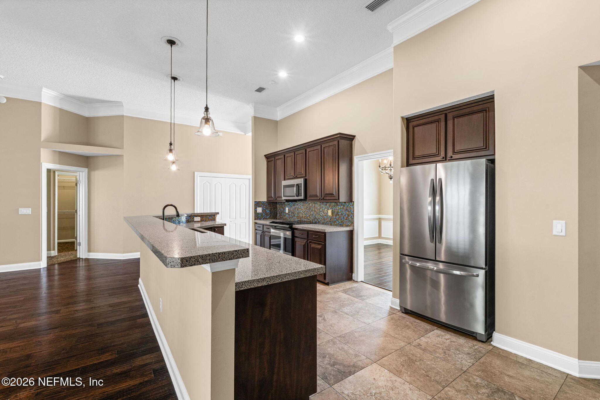 1600 Spring Water Court Fleming Island, FL 32003 - Photo 24 of 85 a kitchen with stainless steel appliances granite countertop a refrigerator a sink a stove and oven