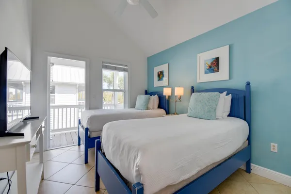 a bedroom with a large bed and a large window
