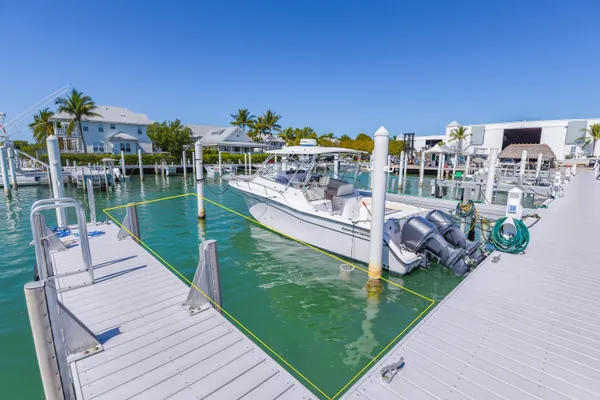 a view of a balcony with two chairs