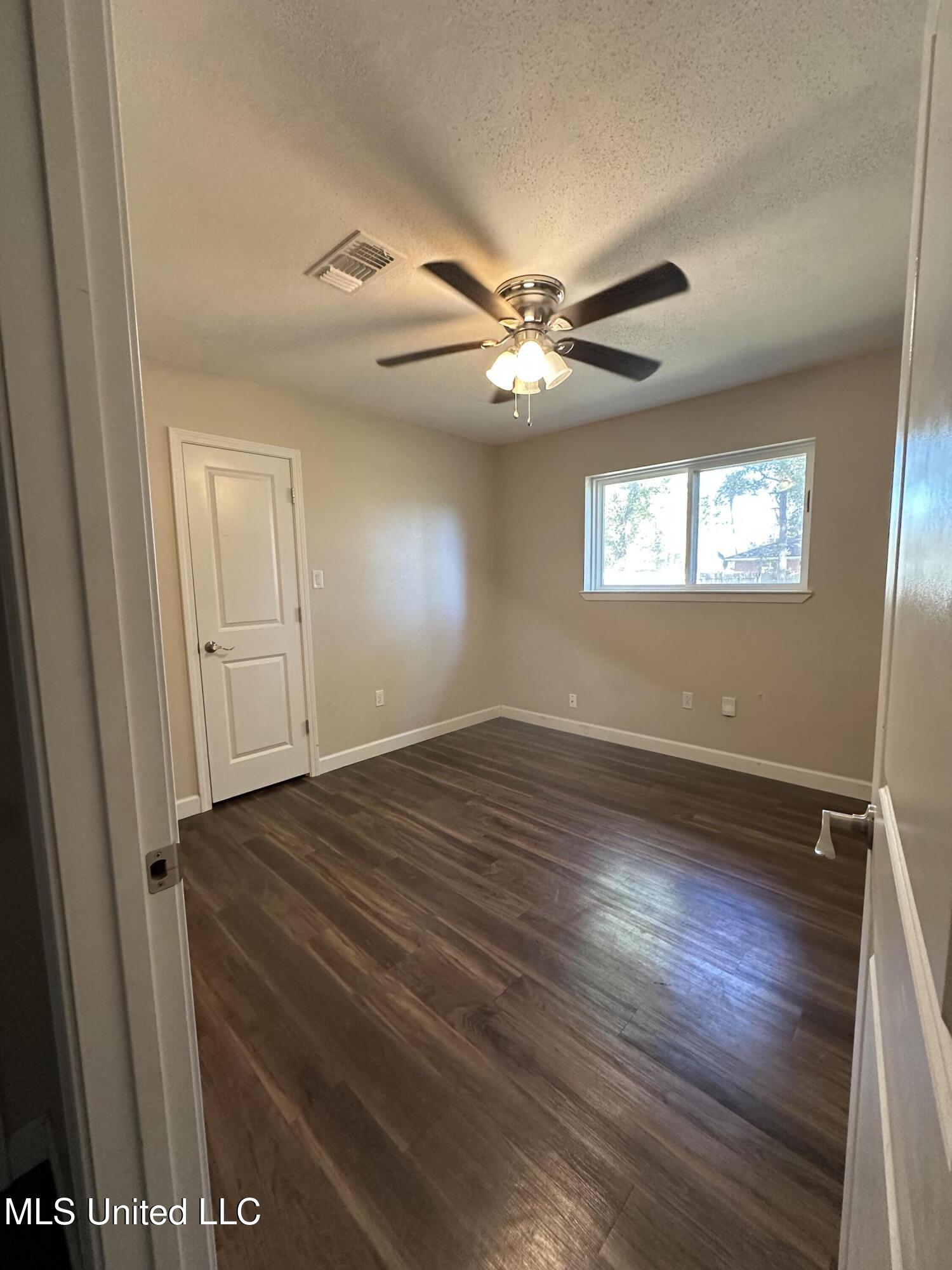 6838 Apona Street Diamondhead, MS 39525 - Photo 14 of 18 Bedroom 3