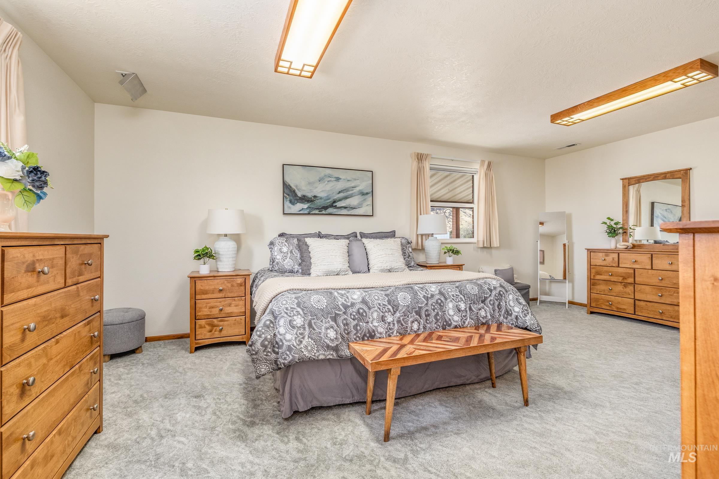 10514 Airpark Loop Road Melba, ID 83641 - Photo 10 of 47 Bedroom with light colored carpet
