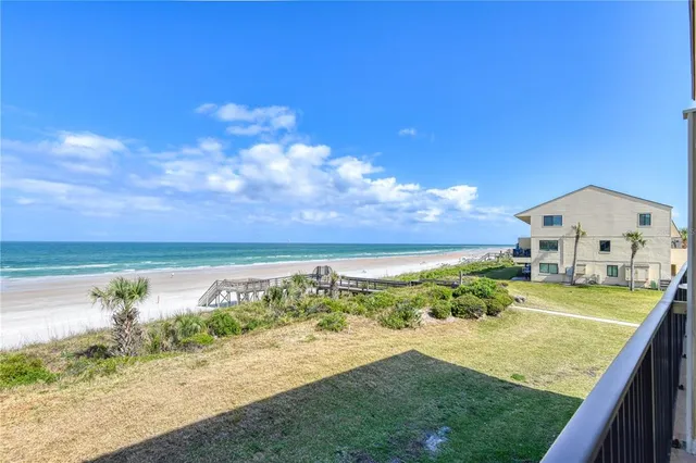 a view of a lake with a big yard