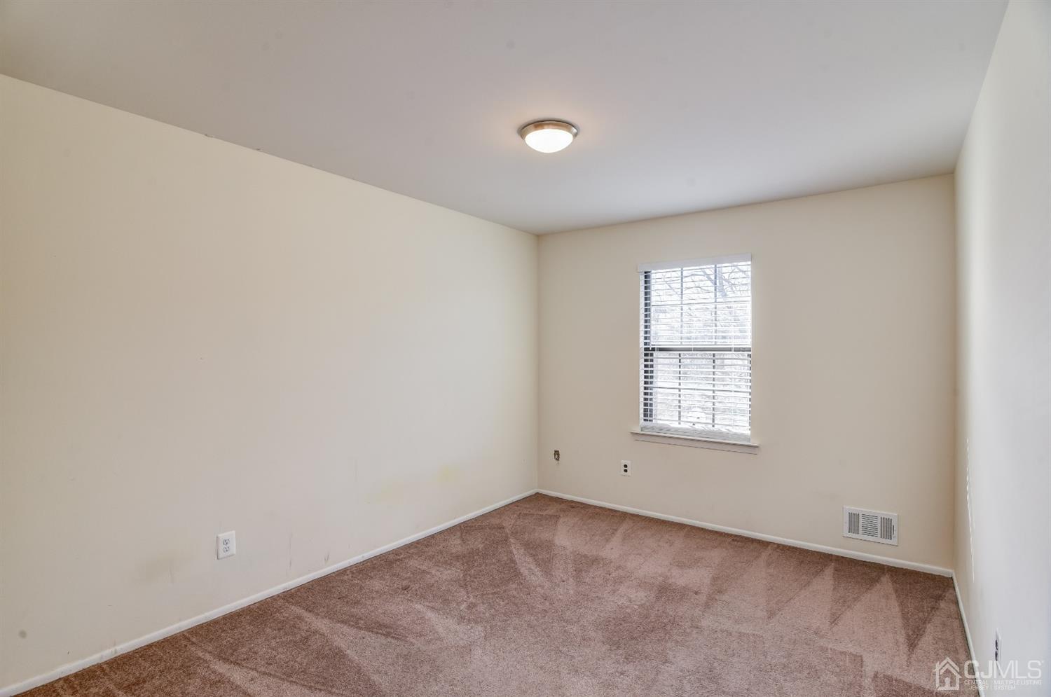 6902 Hana Road Edison, NJ 08817 - Photo 12 of 24 an empty room with a window
